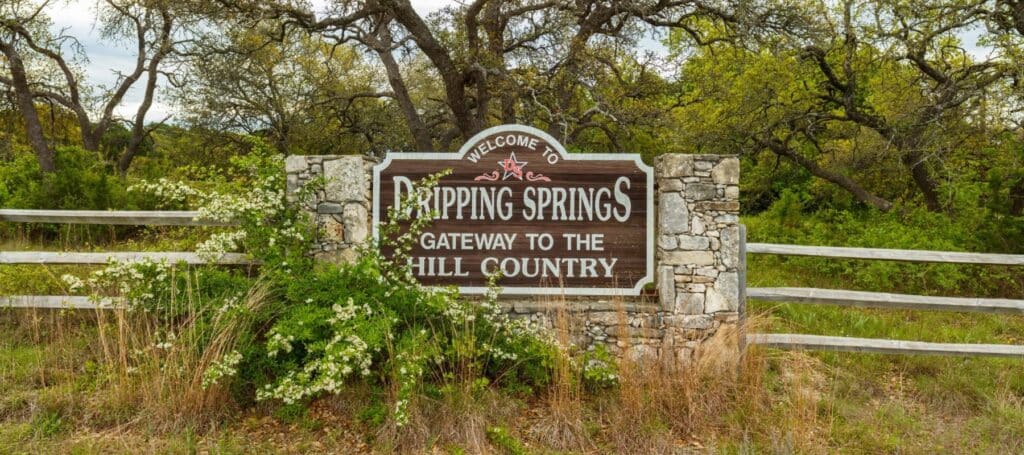welcome to dripping springs city sign