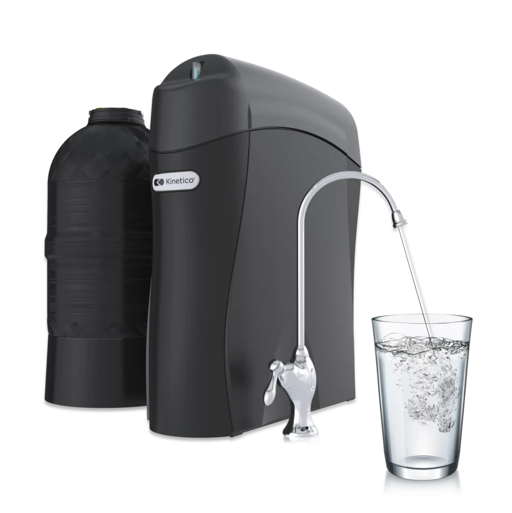 kinetico water system filling up glass of water